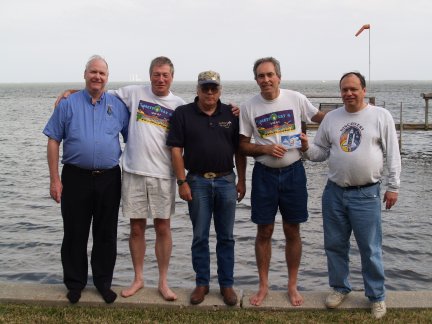 left to right, Bob McCullough (Big Rapids, Michigan), Richard Tonkin (Melbourne, Australia), Matt Nelson (Houston, Texas), Ron Caswell (Titusville, Florida), and Ken Harman (Vancouver, Canada) with Kennedy Space Center in background, January 2006