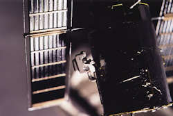 astronaut with MMU attached to HST